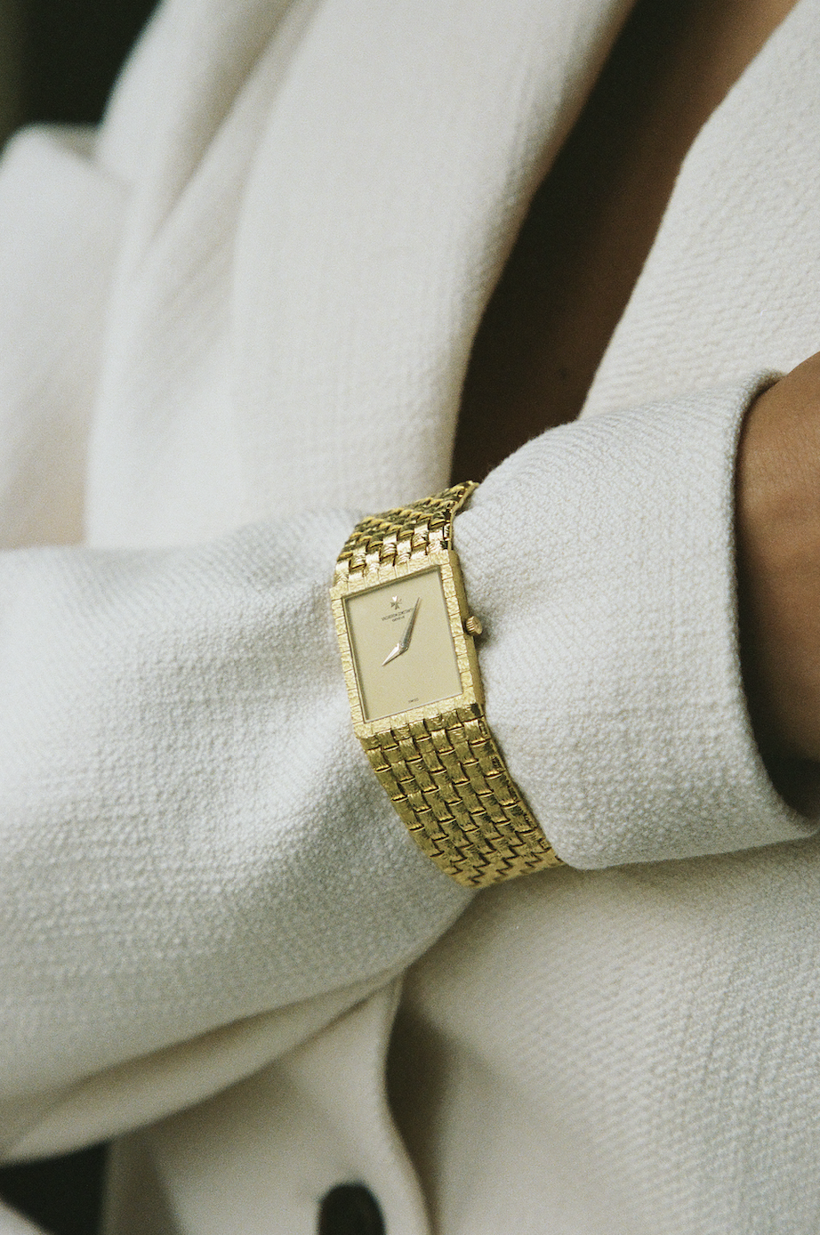 Vintage gold watch on dark silk